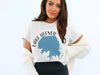 White t-shirt with "Lake Hefner Oklahoma" text and blue lake map design.