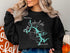 Black sweatshirt with "Deep Creek Lake Maryland" map and compass graphic.