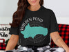 Black t-shirt with Walden Pond Massachusetts map and compass design.