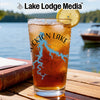 Glass with Stockton Lake map design, iced tea, lemon, and lake background.