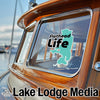 Flathead Life sticker on a boat window with Lake Lodge Media logo.