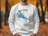 White sweatshirt with blue Canyon Lake, Arizona map and compass graphic.