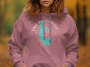 Pink hoodie with turquoise Lake Okeechobee map and compass rose graphic.