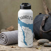 White water bottle with black lid, "CHARLE V" text, blue map outline, and compass rose.
