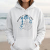 White hoodie with blue Pomme de Terre Lake map and compass graphic.