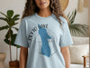 Light blue t-shirt with Peyto Lake Banff design, featuring a blue lake outline and compass graphic.