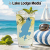 Glass with Lake Tiorati map, limes, mint, and ice on a beach background.