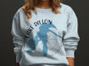 Light blue sweatshirt with Lake Dillon Colorado map and compass design.