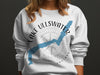 White sweatshirt with Lake Ullswater map graphic and compass design.