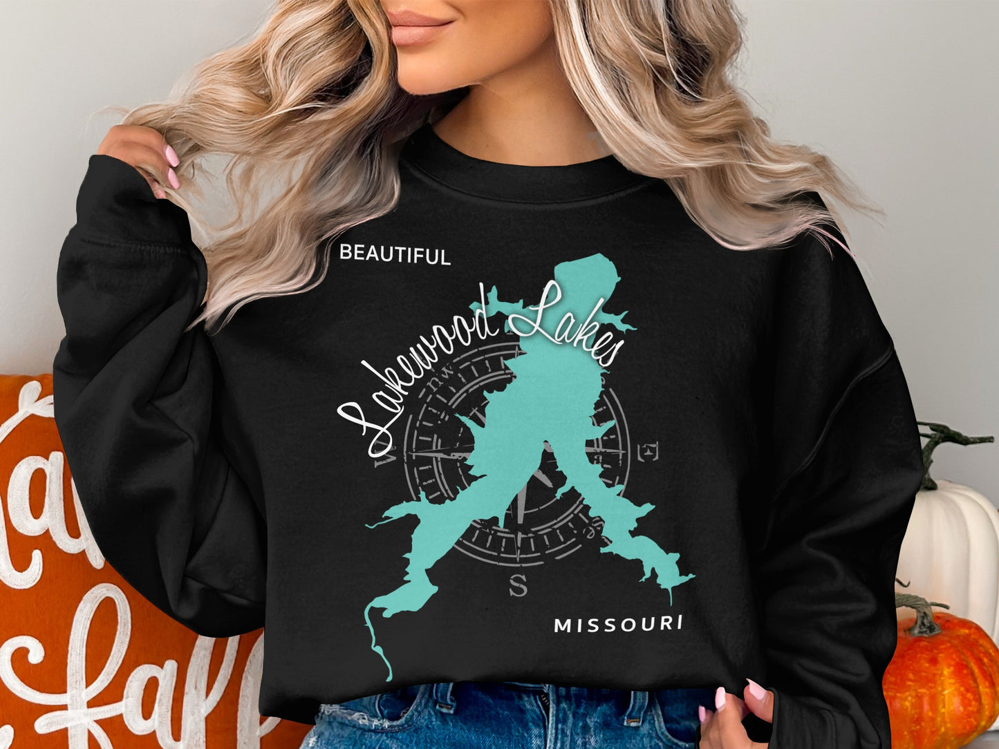 Black sweatshirt featuring a teal map of Missouri with "Beautiful Lakewood Lakes" text.