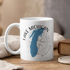 White mug with "Lake Michigan Wisconsin" text, a blue Michigan map, and compass rose design.