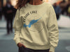 Light yellow sweatshirt with Cedar Lake Ontario map and compass design.