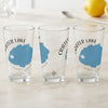 Three clear glasses with Crater Lake Oregon map designs and compass rose details.