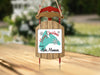 Christmas ornament shaped like a sled, with "Merry Christmas from Lake Manawa" text.
