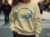 Light yellow crewneck sweatshirt with Wright Patman Lake map and compass graphic.
