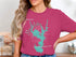 Pink t-shirt with a turquoise lake outline and compass rose graphic.