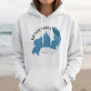 White hoodie with Mendenhall Lake, Alaska map design and compass graphic.