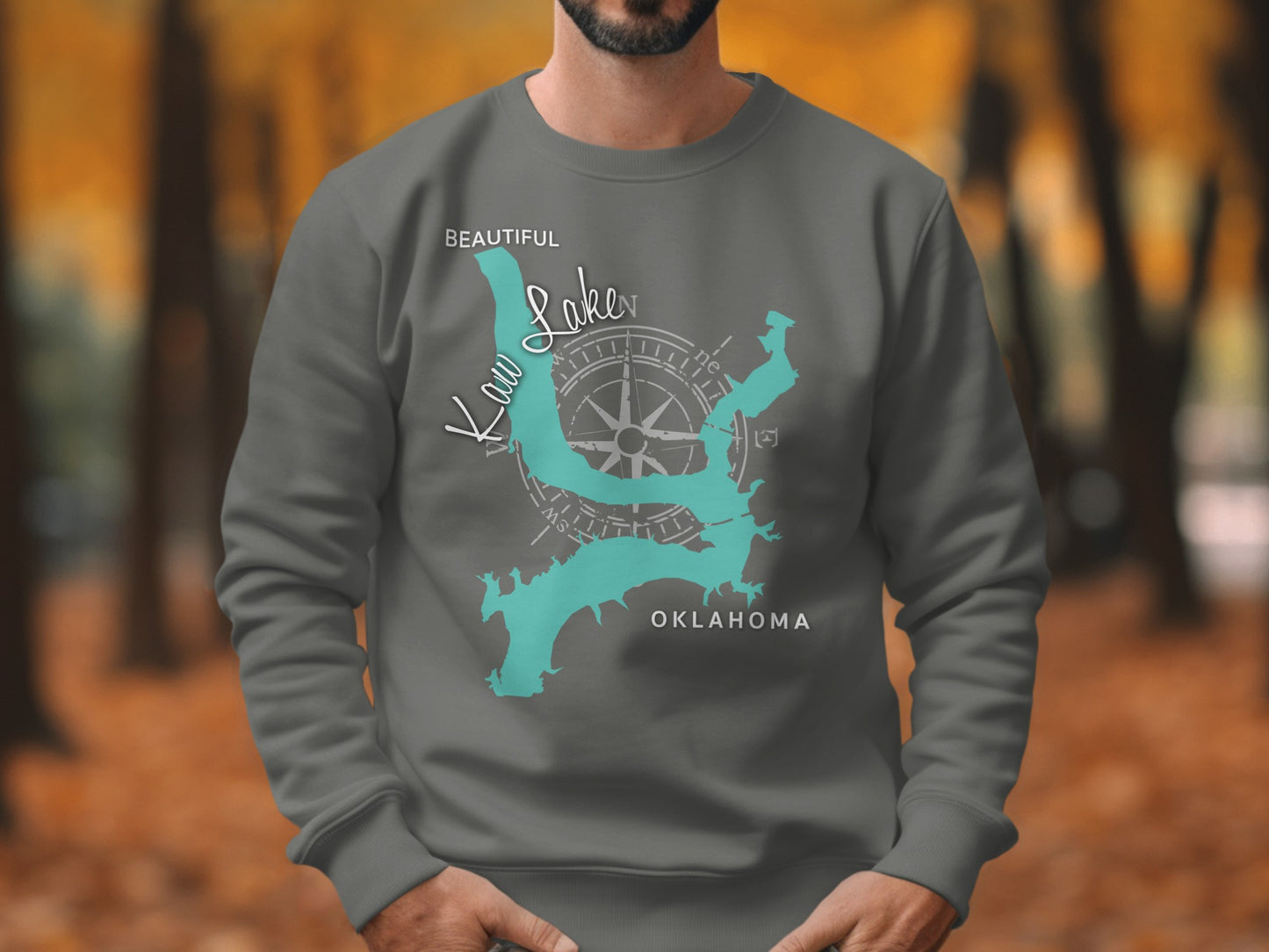 Grey sweatshirt with teal outline of Kaw Lake, Oklahoma and compass rose.