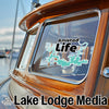Boat window with Amistad Life sticker and Lake Lodge Media logo.