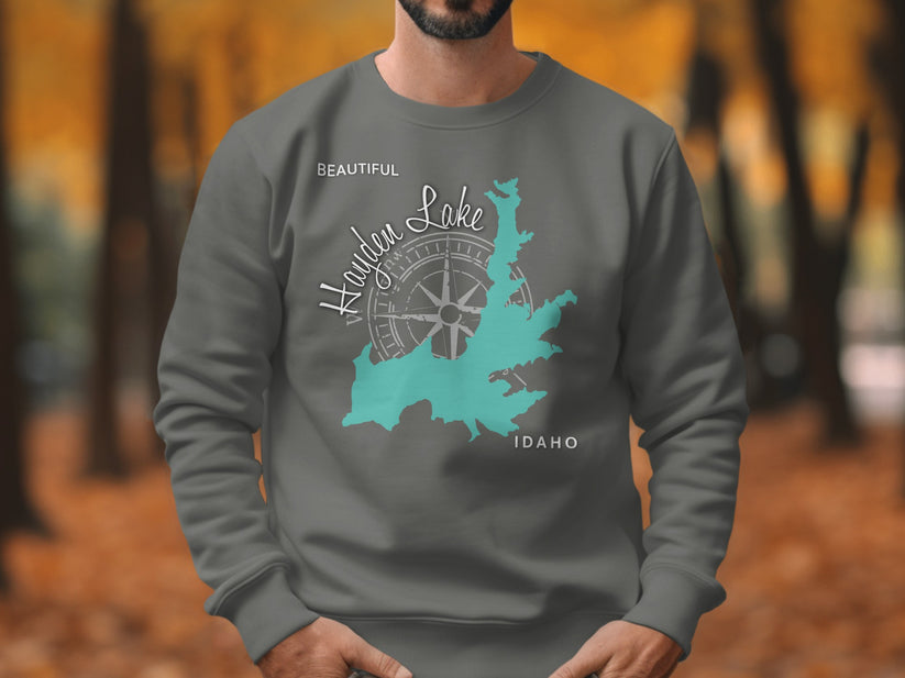 Grey sweatshirt with teal map of Hayden Lake, Idaho and compass design.