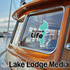 Dunmore Life sticker on a boat window with "Lake Lodge Media" text below.