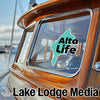 "Alta Life" sticker on a boat window, with "Lake Lodge Media" text and logo below.