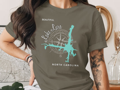 Olive green t-shirt with "Lake Lure North Carolina" and compass graphic.