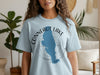 Light blue t-shirt with blue Conneaut Lake map and compass graphic.