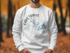 White sweatshirt with Lake Travis Texas map and compass design.