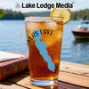 Glass of iced tea with blue lake outline and compass graphic.