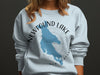 Light blue sweatshirt with Newfound Lake, New Hampshire design and compass graphic.