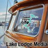 "Coeur d'Alene Life" sticker on boat window with "Lake Lodge Media" logo below.