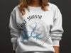 White sweatshirt with Lake Shasta California compass and map graphic.
