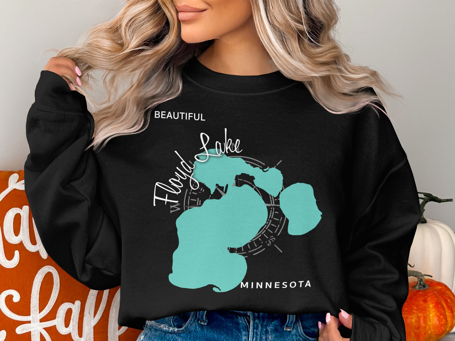 Black sweatshirt with teal Floyd Lake map design and compass rose.