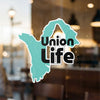 Turquoise shape sticker with black text "Union Life," © Lake Lodge Media LLC.