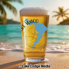 Glass of beer with Lake Waco map and compass design on a beach.