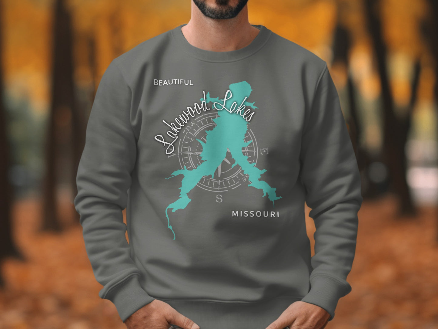 Dark grey sweatshirt with turquoise Lakewood Lakes Missouri map and compass design.