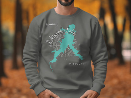 Dark grey sweatshirt with turquoise Lakewood Lakes Missouri map and compass design.