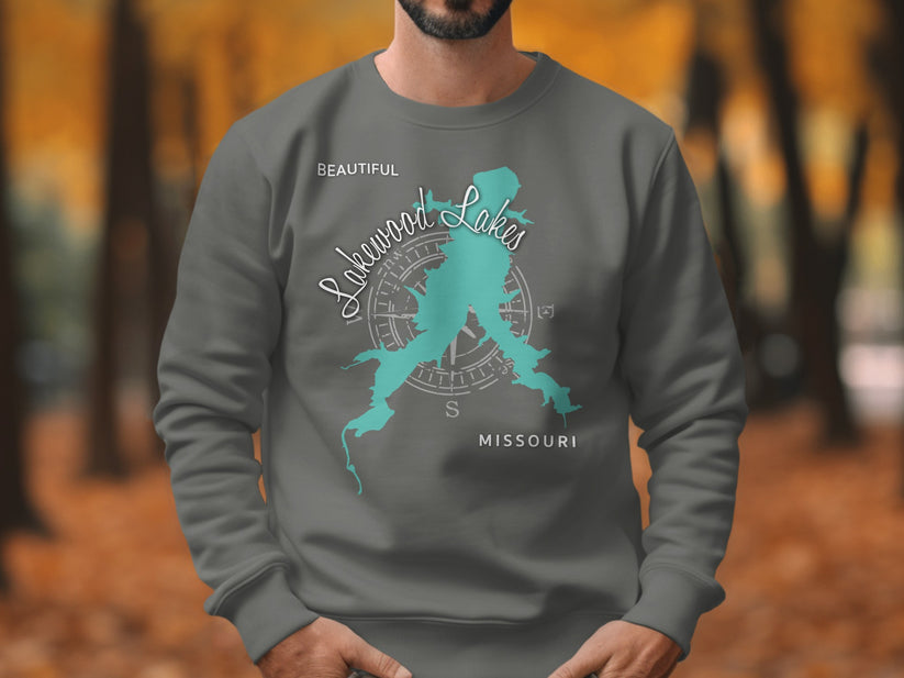 Dark grey sweatshirt with turquoise Lakewood Lakes Missouri map and compass design.