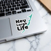 "Key Largo Life" text and Key Largo map sticker on a laptop.