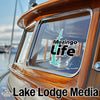 Sticker of a lake silhouette on a boat window with "Mozingo Life" and "Lake Lodge Media" text.