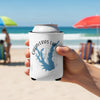 Calaveras Lake Texas can cooler held by hand on a beach.