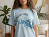Light blue t-shirt with "Canyon Lake Texas" text and lake graphic compass.