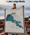 Man holding Clear Lake California map blanket with compass design.