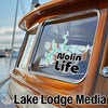 Nolin Lake Life decal on a wooden boat window with Lake Lodge Media logo.