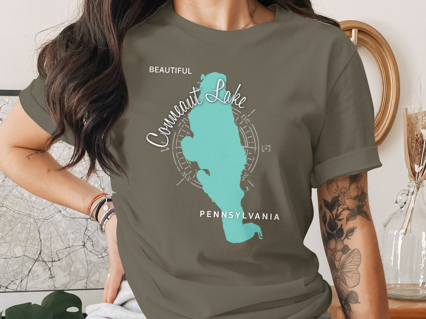 Green t-shirt with light blue map outline of Conneaut Lake, Pennsylvania.