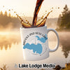 White mug with Brooks and Hess Lake Michigan logo pouring coffee