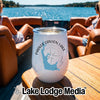 A white stemless wine tumbler with a Parker Canyon Lake, Arizona graphic rests on a boat table.