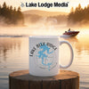 White mug with Lake Blue Ridge Georgia map and compass on a wooden surface.