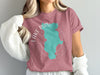 Dusty rose t-shirt with turquoise Lake Piru map graphic and compass rose with text.